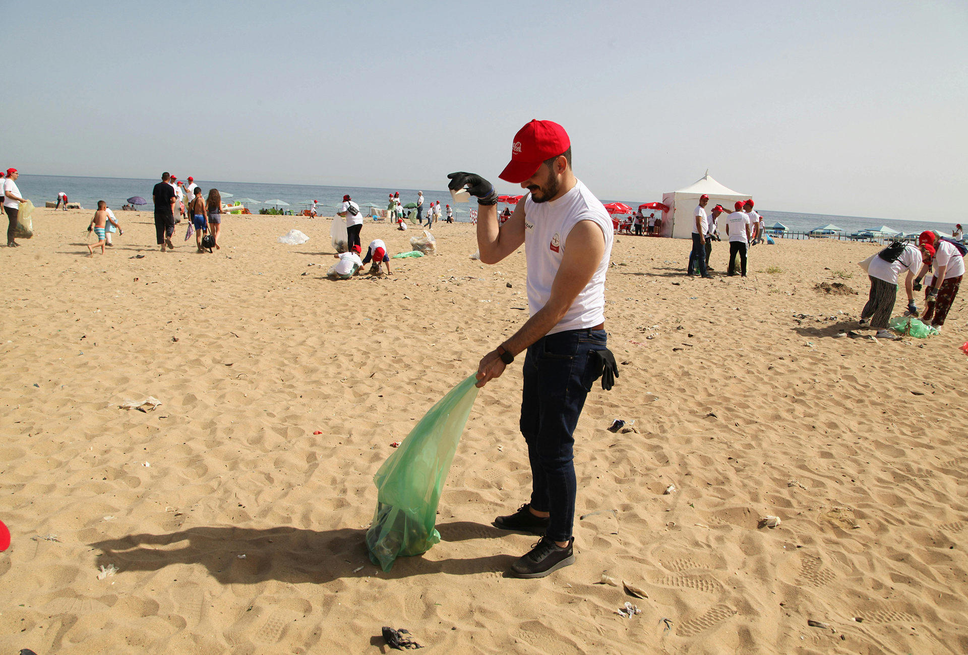 project-2 volunteers on a beach